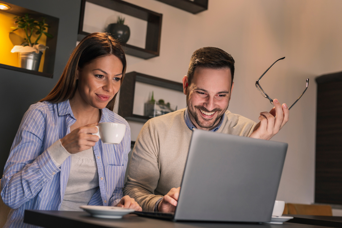 Couple using laptop computer